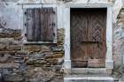 A view of a wooden door and shuttered window Isola-Slovenia Art Print